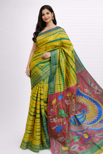 Generate a ecommerce style picture of an indian model wearing the given saree in the picture. the model is Indian lady, good looking with a sweet smile and long hair, wearing minimal jewelry and matching blouse. the picture should be like e commerce photoshoot. Background will be like real studio. The picture should attract viewers for buying. finish image will be in 2:3 ratio. Change the pose from earlier generated image.